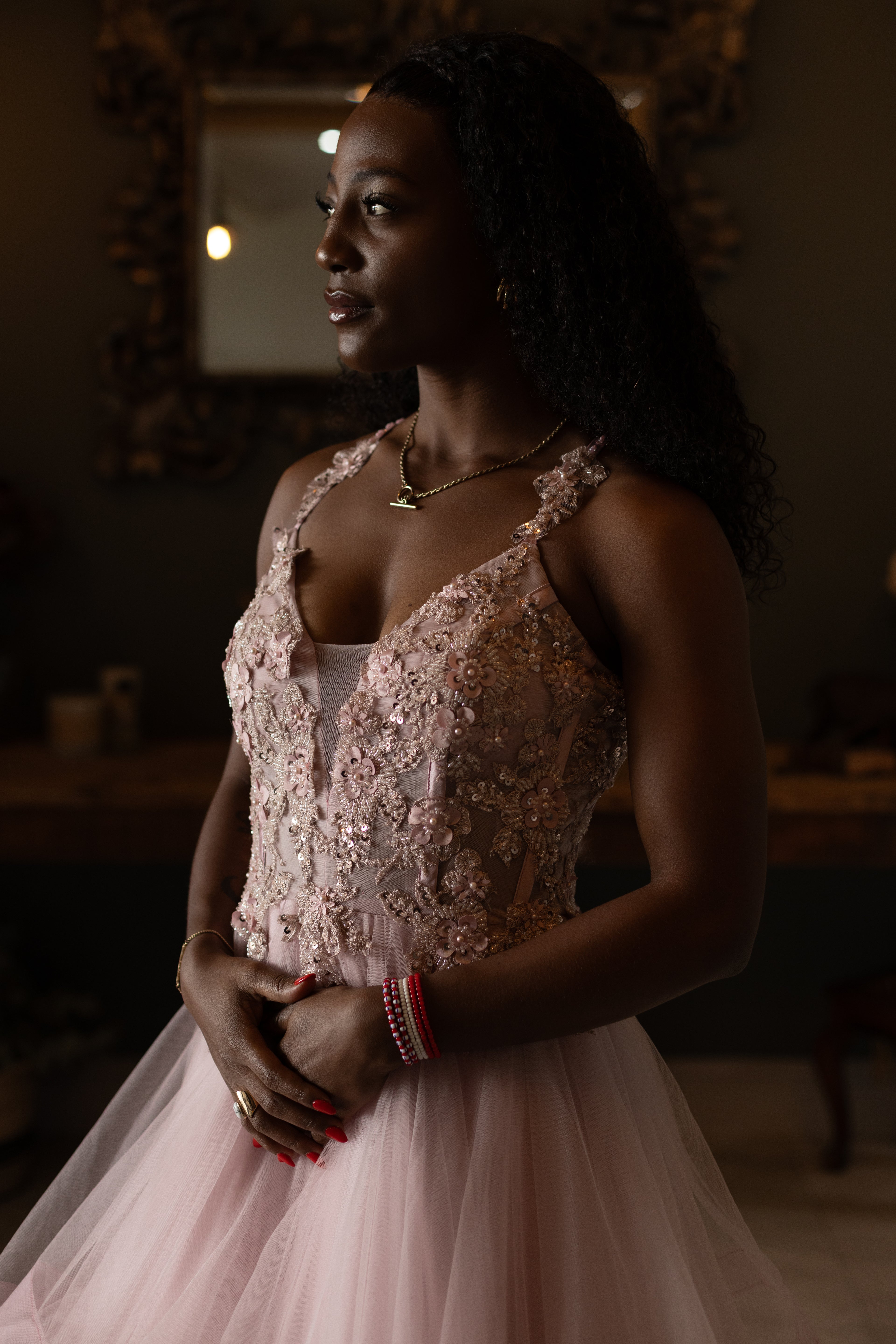 Soft pink layered dress with floral beaded top and lace up back.