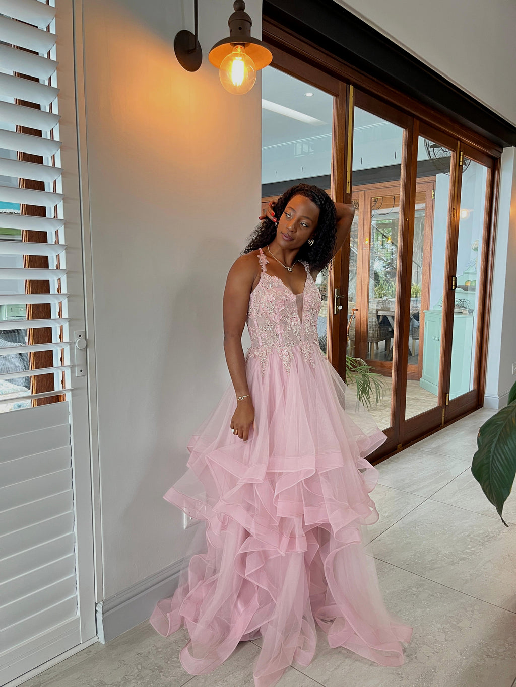 Soft pink layered dress with floral beaded top and lace up back.